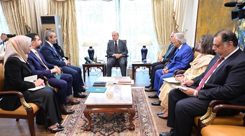 Prime Minister Shehbaz Sharif talks to a Syrian delegation.