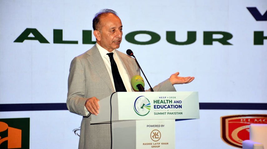 Musadik Malik speaks at a conference.