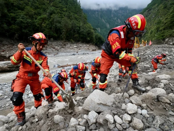 Rescuers searching for Nepal flood survivors.