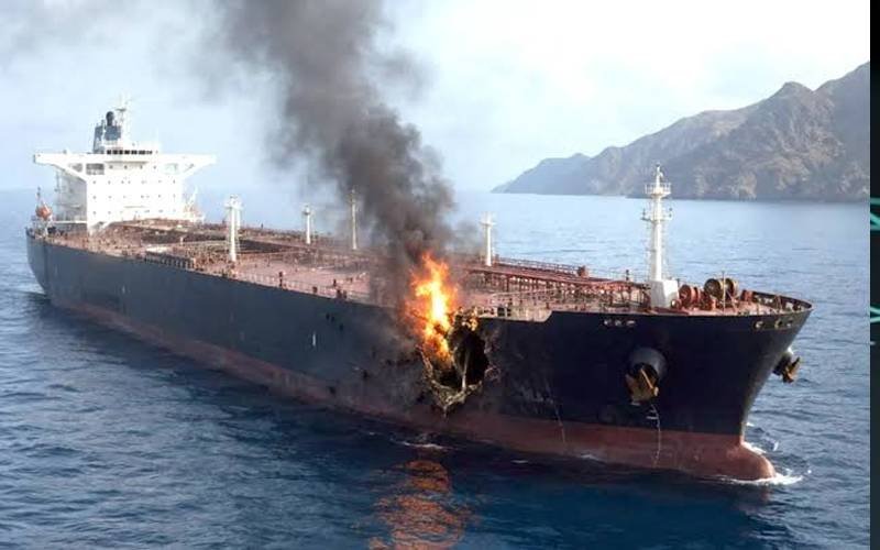 An oil tanker under fire near Oman.