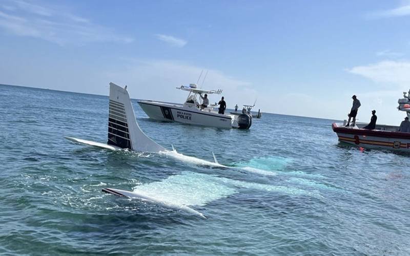 The plane sits in water on Florida beach