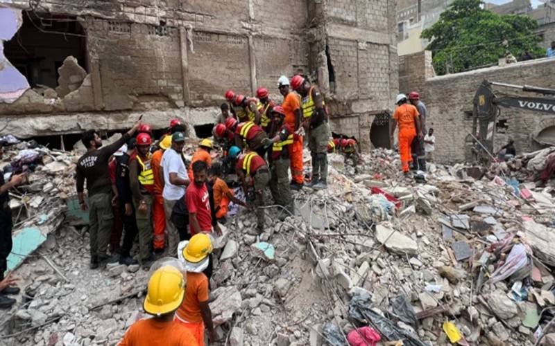 Rescuers at the collapsed building.