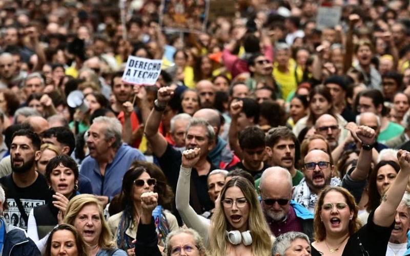 Protesters chant slogans against unemployment and rising inflation in Rome.