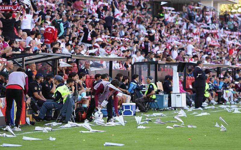 Paper plane attack on football ground