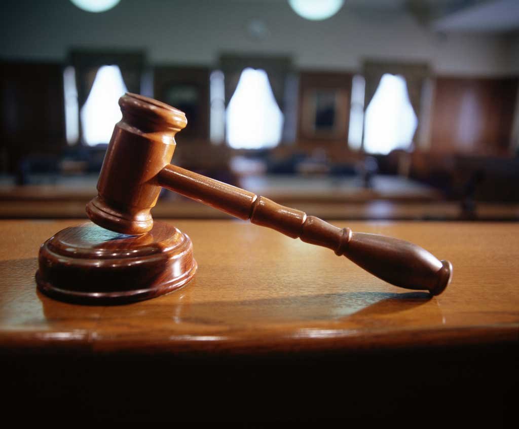 Man, son remanded for torching Rangers post