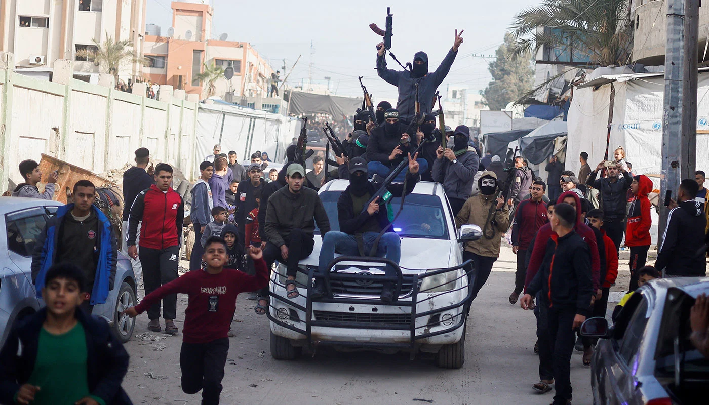 Palestinian fighters back to devastated Gaza streets after ceasefire